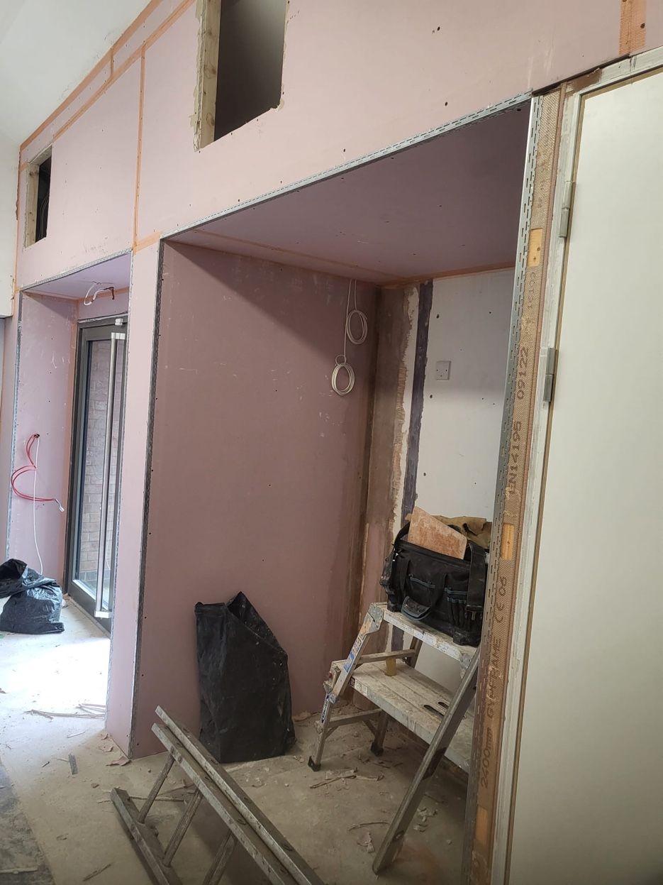 New partition walls boarded around the doorways