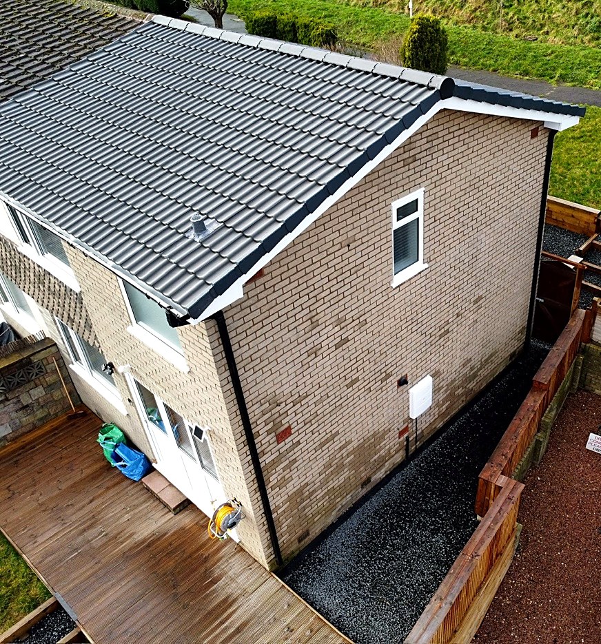 Aerial view of a semi-detached house with a newly tiled roof